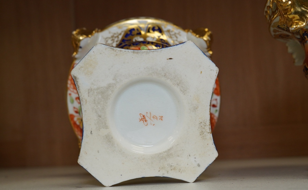 A pair of Derby Imari pattern pot pourri pots and covers, 14cm high. Condition - gilding worn in places and one pot has two fine cracks to interior top edge and flower, a few finial petals are damaged